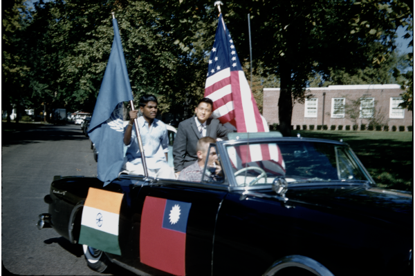 International students in a parade car