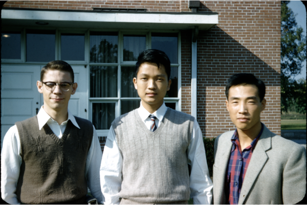 Students posing outside of a campus building