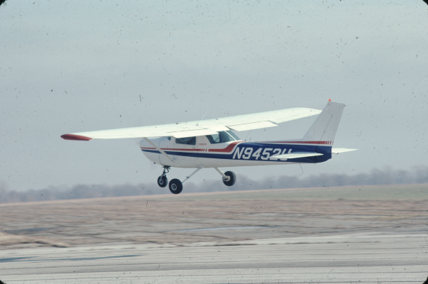 Cessna 152 airplane landing on the runway