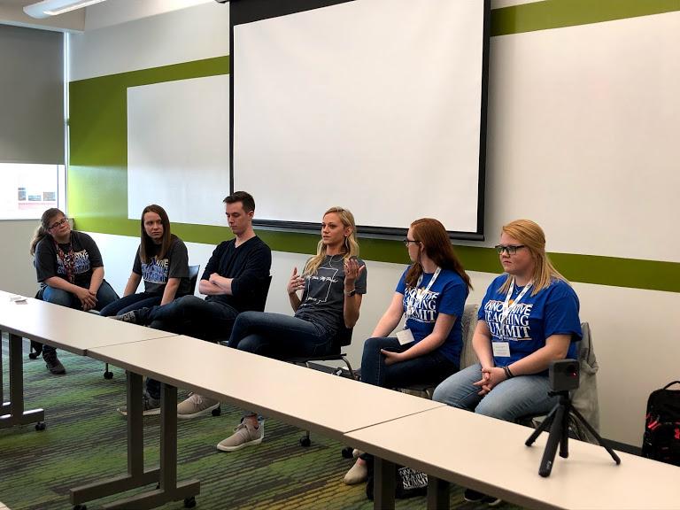 Students on a panel at the front of the classroom