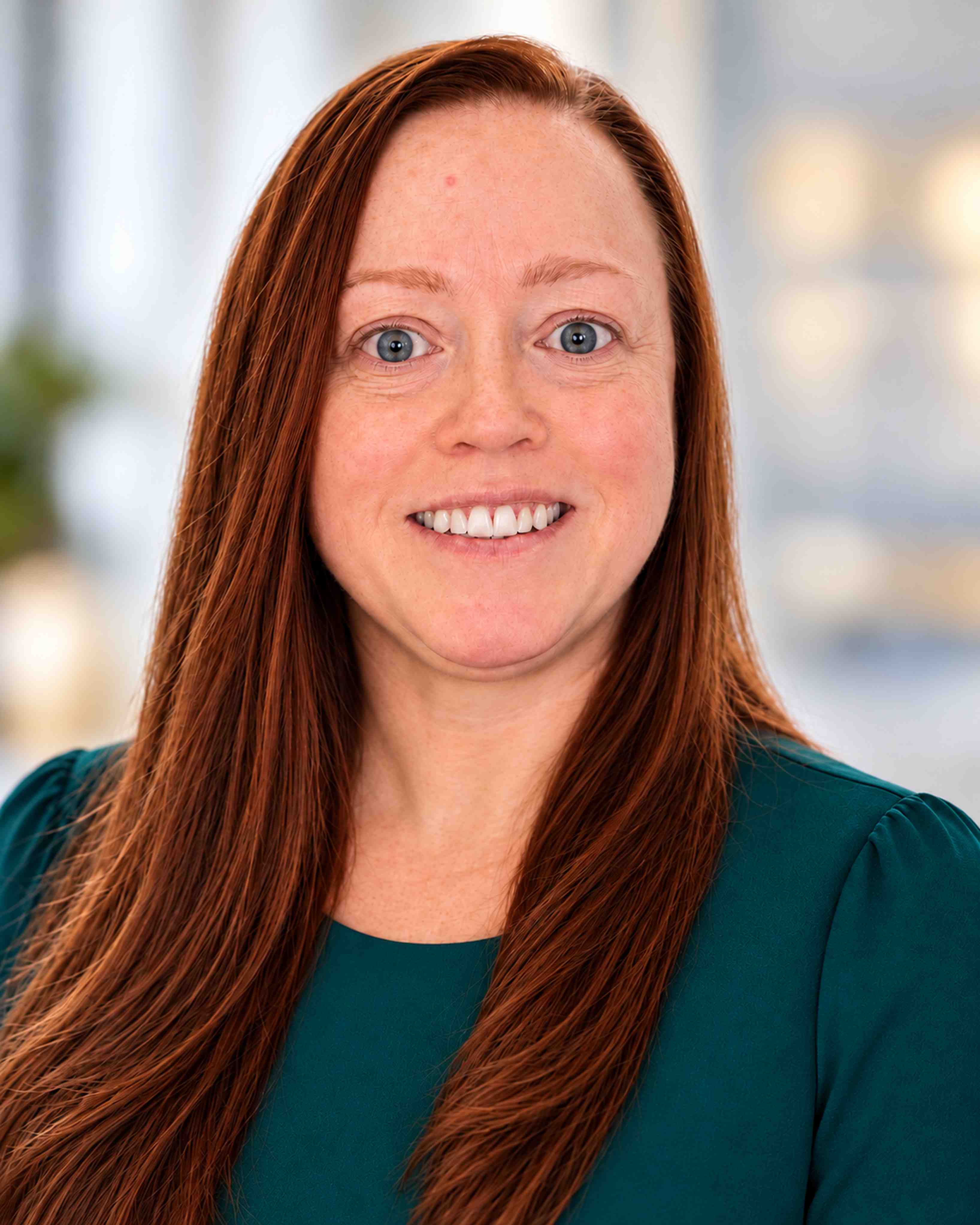  Headshot of Jillian Kiefer who has long straight red hair