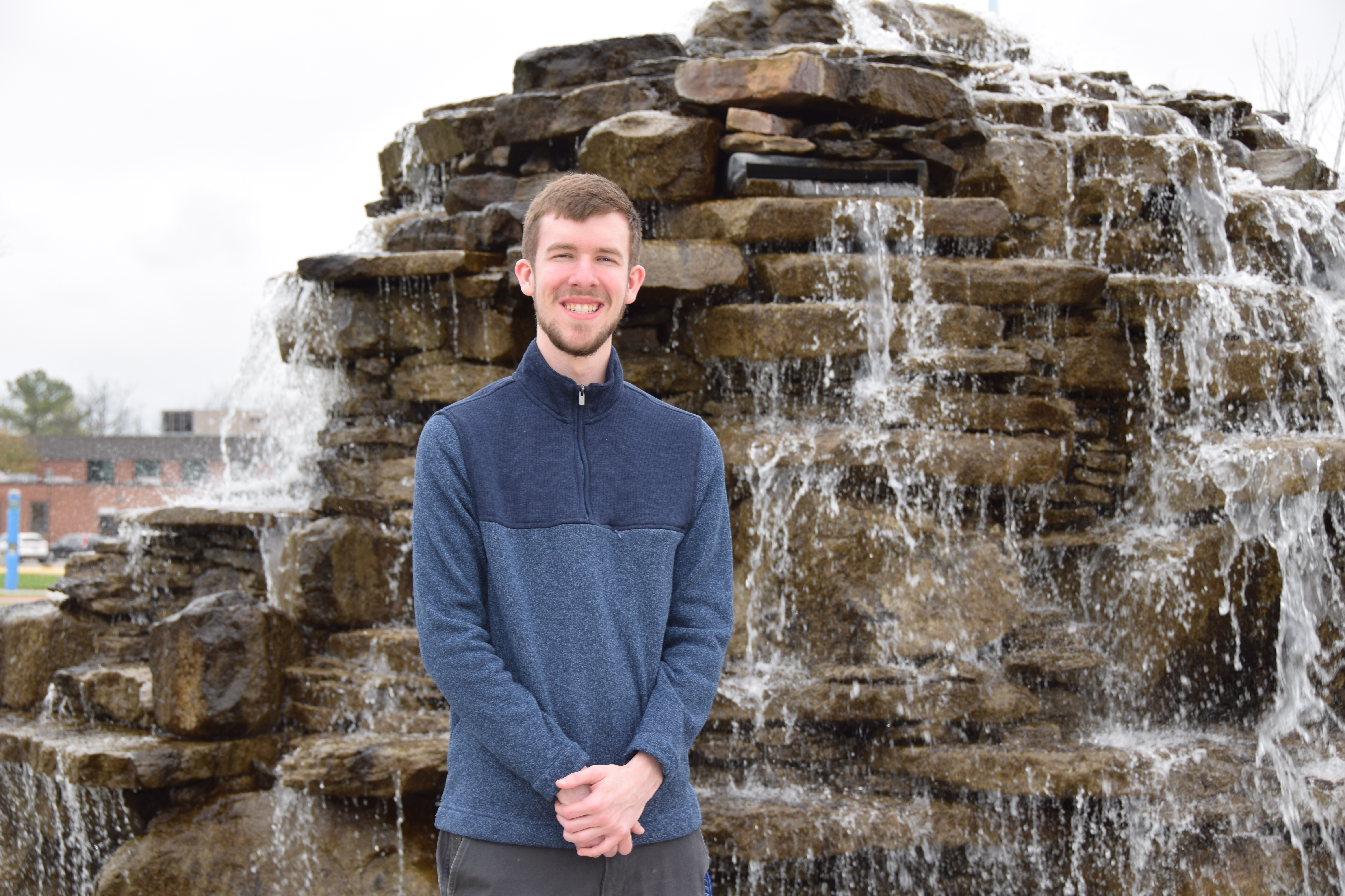 VU student Brock Wilson stands in front of the water fountain located near Updike Hall