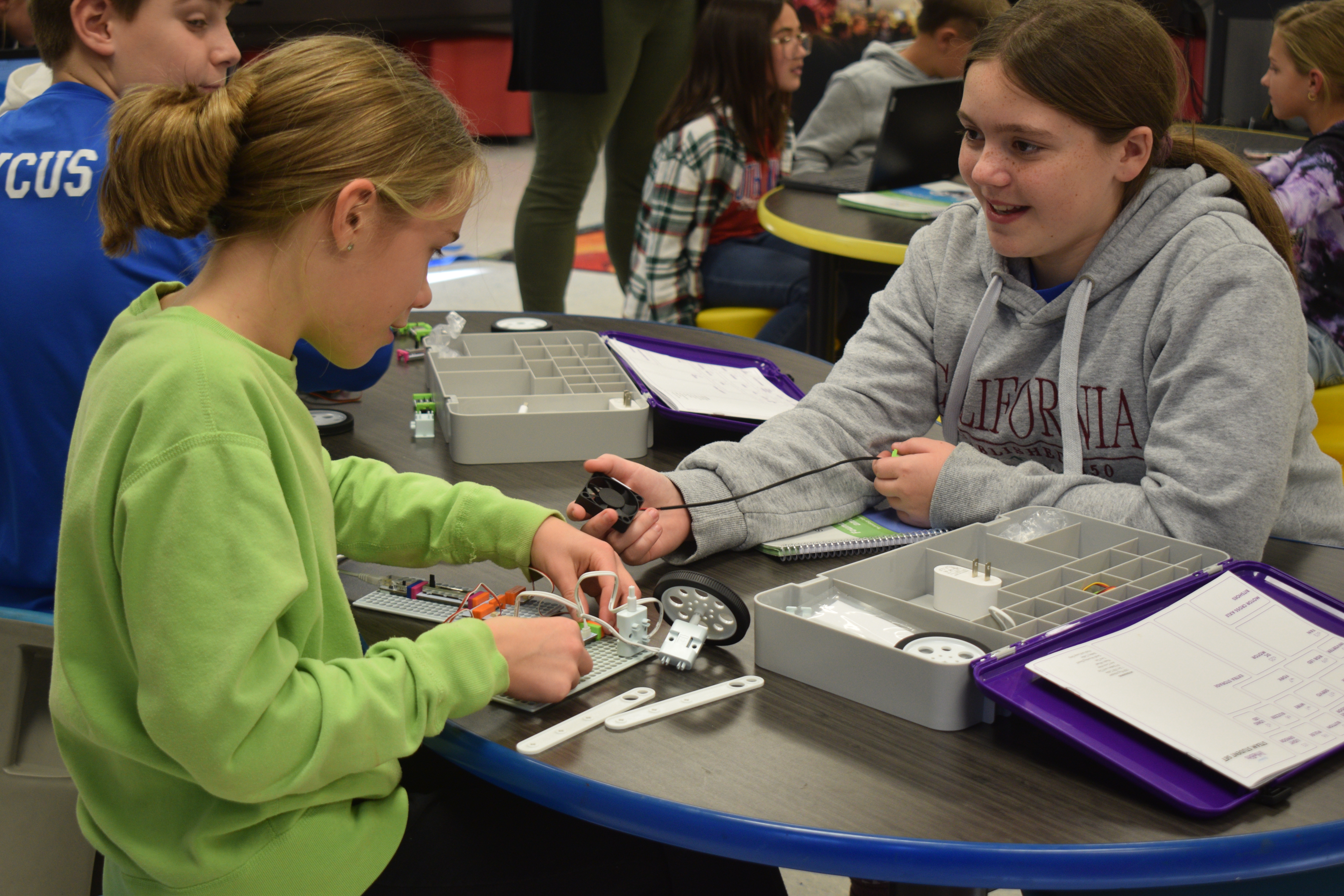 Two female South Knox Elementary School students participating in a hands-on learning project in the school's Design and Innovation Studio.