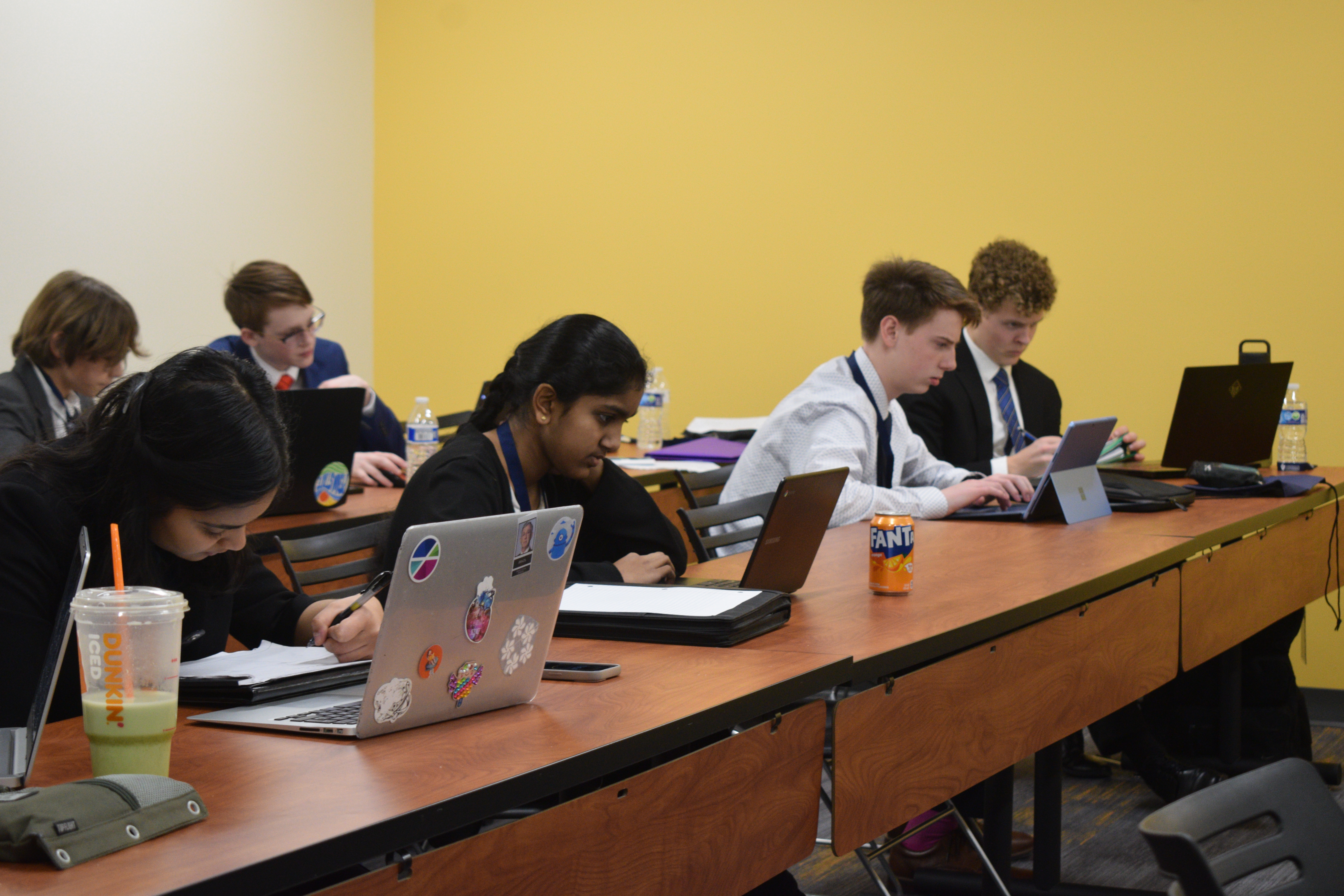 A diverse group of high school students prep in a VU classroom.
